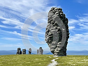 Stone pillars of weathering on the Manpupuner mountain plateau in the Komi Republic in Russia in summer in clear weather