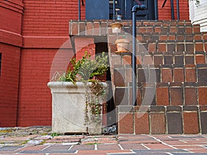 Stone planter against brick wall