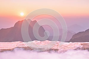 Stone podium outdoors on sky pink pastel soft cloud with misty mountain nature landscape background.Beauty cosmetic product