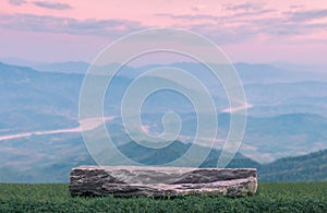 Stone podium tabletop floor in outdoor sunrise sky blue pink pastel with mountain nature landscape background.cosmetic product