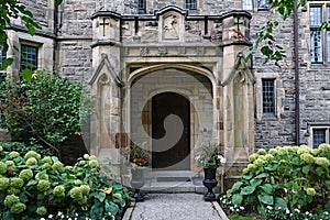 Stone portico entrance of gothic style college building
