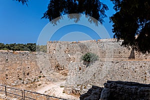 Stone powerful walls of old city, the ancient defense of Old Town, Rhodes, Dodecanese, Greece.