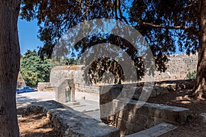 Stone powerful walls of old city, the ancient defense of Old Town, Rhodes, Dodecanese, Greece.