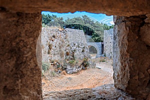 Stone powerful walls of old city, the ancient defense of Old Town, Rhodes, Dodecanese, Greece.