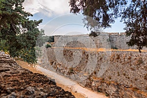 Stone powerful walls of old city, the ancient defense of Old Town, Rhodes, Dodecanese, Greece.