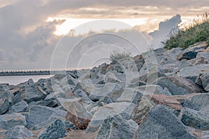 Stone protection wave at Gorki Zachodnie beach at sunrise.