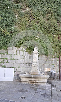 Historic Fountain from Rua de Mouzinho da Silveira Street in Downtown of Porto in Portugal photo
