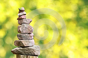 Stone pyramid in front of blurry background with bokeh