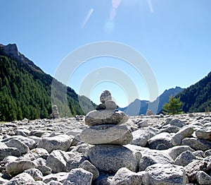 Stone pyramids, little man, mound, ovoo, Inukshuk in the blue sky
