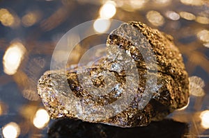 Stone pyrite on a glowing background