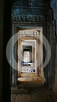 Stone rock door interior decoration in Bayon Temple in Angkor wat complex, Siem Reap Cambodia