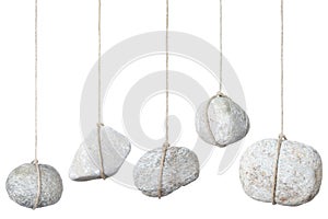 Stone, rock hanging by a string