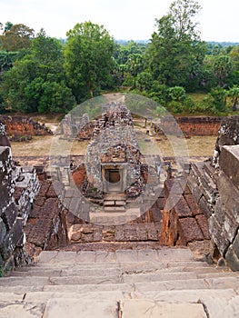 Stone rock ladder at Ancient buddhist khmer temple architecture ruin of Pre Rup in Angkor Wat complex, Siem Reap Cambodia