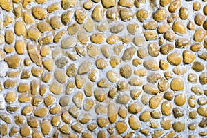 Stone rock pebble concrete wall.