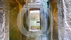 Stone rock ruin window at Ta Prohm Temple in Angkor wat complex, Siem Reap Cambodia