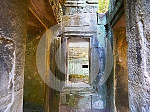 Stone rock ruin window at Ta Prohm Temple in Angkor wat complex, Siem Reap Cambodia