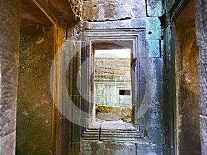 Stone rock ruin window at Ta Prohm Temple in Angkor wat complex, Siem Reap Cambodia