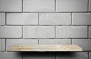 Stone rock shelf counter on gray brick for product displa