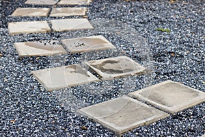 Stone rock walkway with concrete plate background