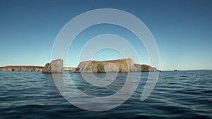 Stone rocks among the watery surface of Arctic Ocean on New Earth.