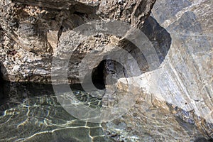 Stone rocky shore against the backdrop of the sea ocean. Summer mood