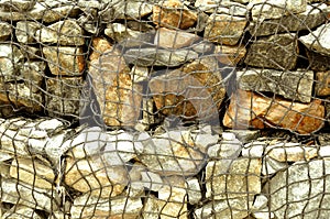 Stone in rope mesh at beach