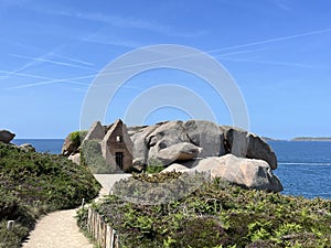 Ruins of a former gunpowder store on a Pink Granite Coast in Brittany, France. Atlantic ocean photo