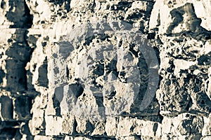Stone ruined wall collapses in parts photo