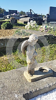 Stone sad angel at cemetery in Slatina - Croatia