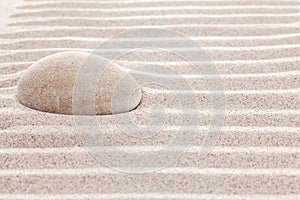 Stone in sand, spa or spiritual background