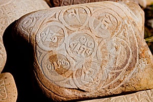 Stone with sanskrit written in mountain