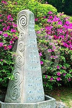 Stone sculpture art and flowers