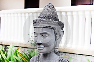 Stone sculpture of a girl in Khmer headdress