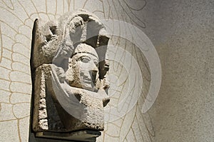 Stone sculpture of the head of a man inside a serpent of the may