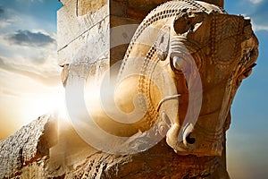 Stone sculpture of a horse in Persepolis against a sunrise. Iran. Persia. Shiraz.