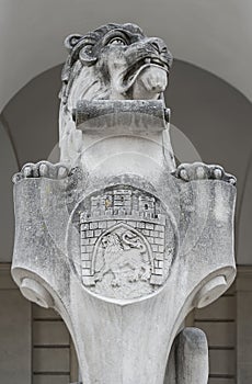 Stone sculpture of sitting lion at the entrance of Town Hall, Ukraine