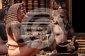 Stone sculputure sitting in front of temple B