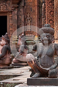 Stone sculputure sitting in front of temple