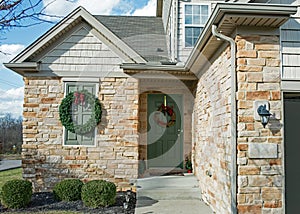 Stone and Shake Entrance with Christmas Wreaths