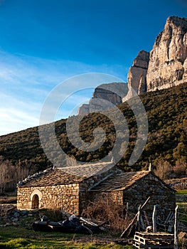 Stone shanty and PeÃÂ±a MontaÃÂ±esa in the Pyrenees. photo