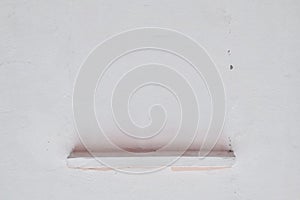 Stone Shelf on Bare Concrete Wall Background