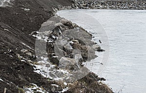 stone shoring on the river bank