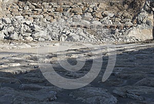 stone shoring on the river bank