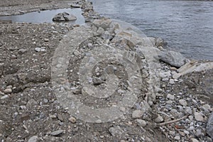 stone shoring on the river bank