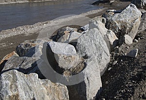 stone shoring on the river bank