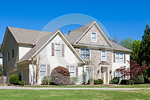 Stone and Siding House in Spring