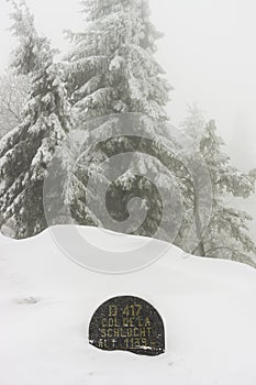 Stone sign covered in snow