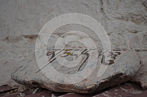 A stone with a sign in Ladakhi language