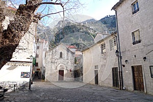 Stone square in Montenegro, historical buildings and aesthetics