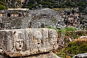 Stone stage masks in front of theater at Myra Turkey